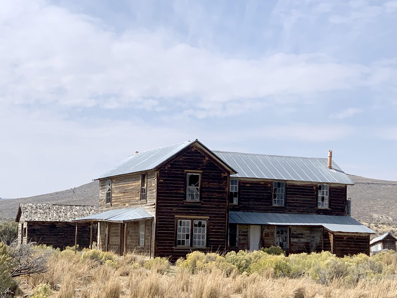 The Shirk Ranch house. I imagine all windows had the glass replaced and doors fixed as well. I imagine the inside fixed up well enough to stay in it for a few weeks and write in the room where everyone, family and ranch hands, ate. I picture a wood table and a few chairs. 